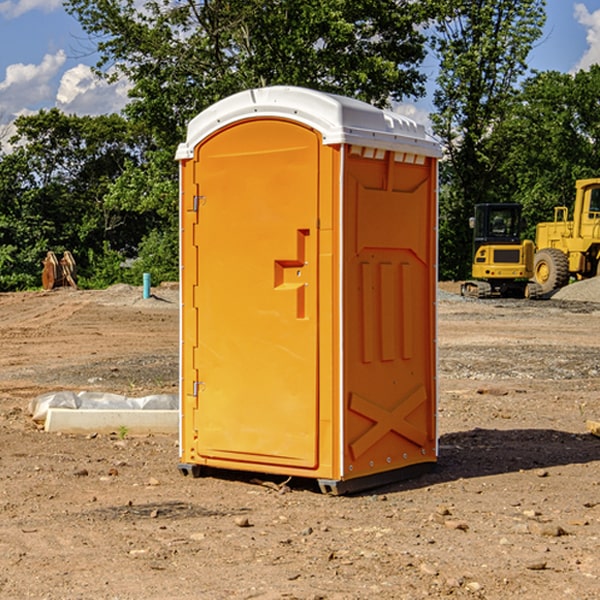 what is the cost difference between standard and deluxe portable toilet rentals in Volborg